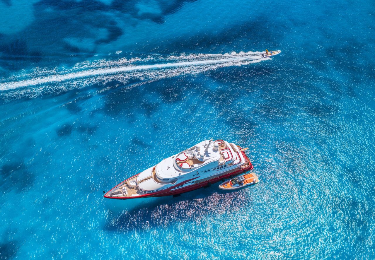 aerial-view-of-beautiful-luxury-yacht-and-boat-in-blue-sea.jpg
